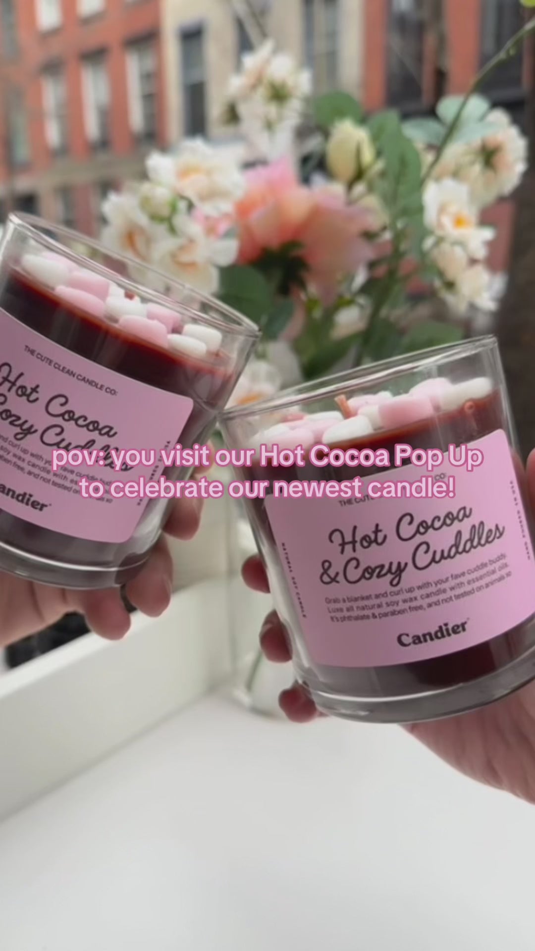 Video of Candier Pop-up event. A close-up of the Candier Hot Cocoa & Cozy Cuddles candle, showcasing its realistic wax marshmallows and rich chocolate wax. This sweet-scented candle brings chocolate shop vibes straight to your home. The ultimate luxury hot cocoa-scented candle, hand-poured in the USA.