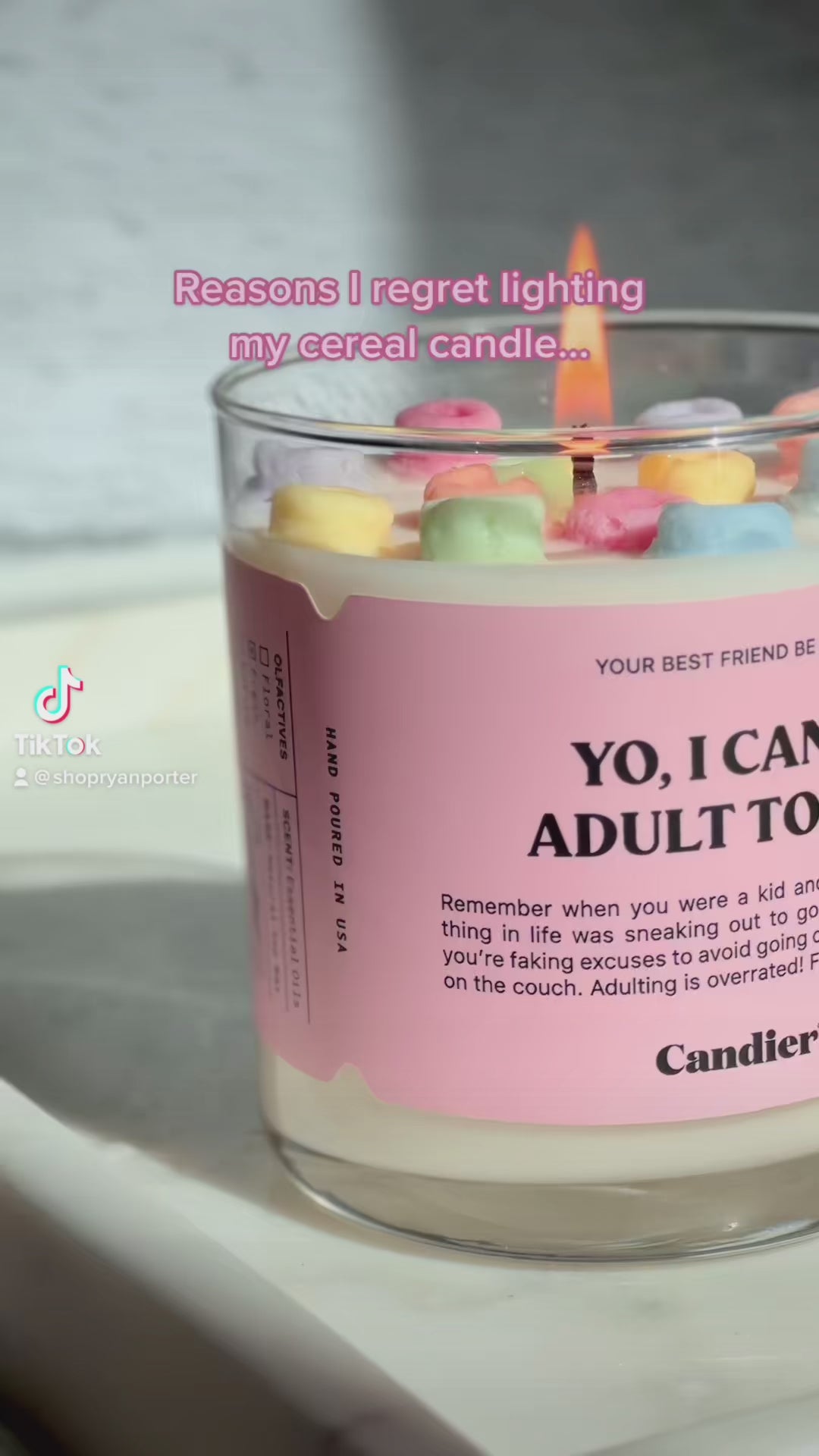 https://www.shopryanporter.com/products/munchies-cereal-candle-1	"Luxury candle with a creative cereal design on top, encased in a pink-labeled glass jar."